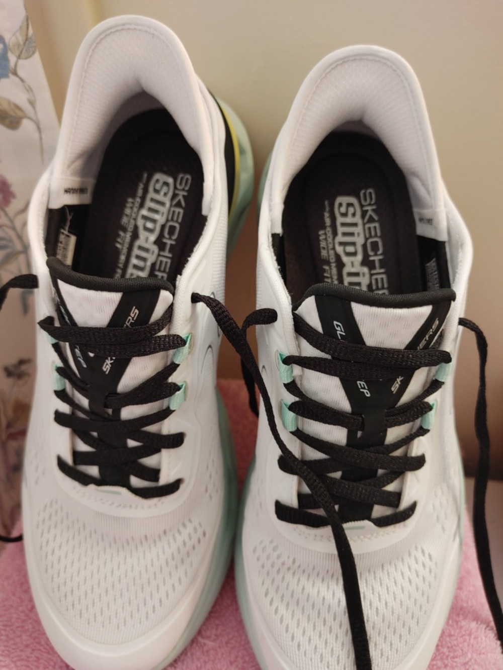 Skechers Women’s White Athletic Sneakers with Black Laces and Mint Sole Accents